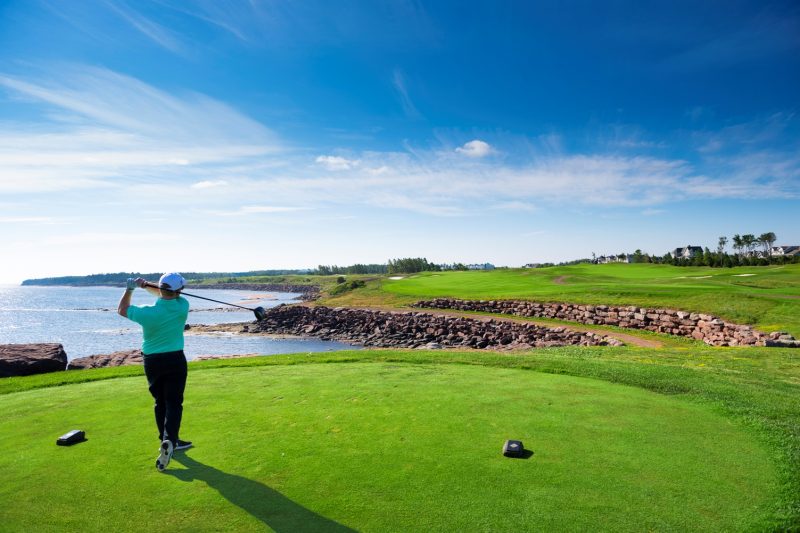Golfer on the green at Fox Harb'r Resort, Nova Scotia